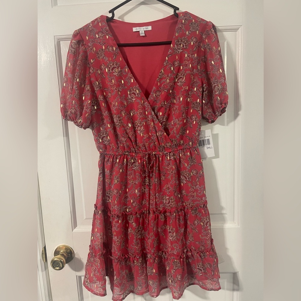 City Vibe light nicely flowing fully lined dress. Never worn. Junior size S